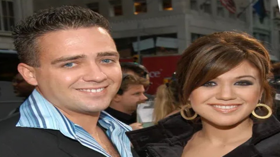 Jason Clarkson and sister Kelly Clarkson at an industry gala