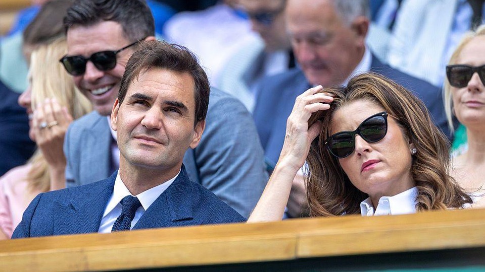 Mirka Federer and Roger Federer seated in the Royal Box during the Wimbledon Championships